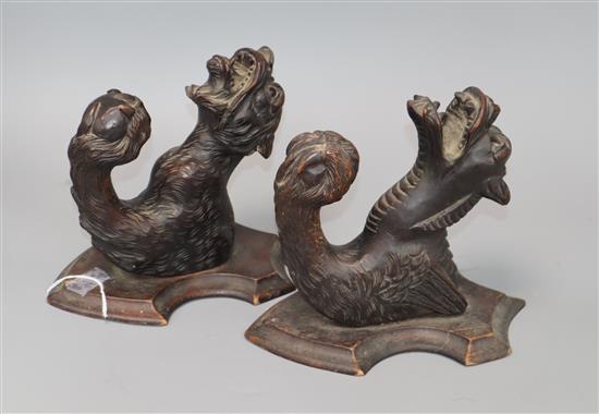 A pair carved coat hangers - a tiger and a gargoyle both with glass eyes L.21cm. W.14cm, D.18cm
